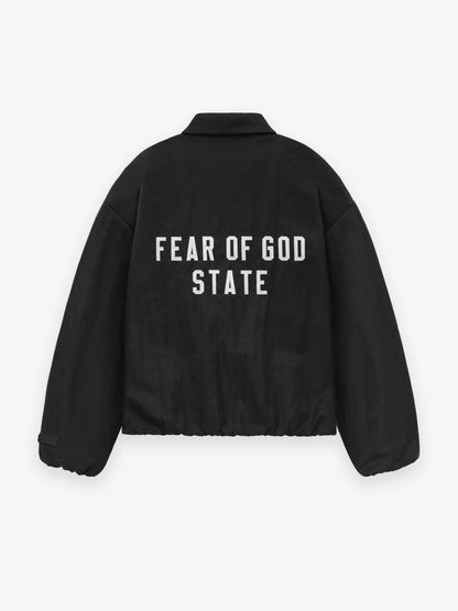 FEAR OF GOD ESSENTIALS 24FW stand collar windbreaker with appliqué letter embroidery.