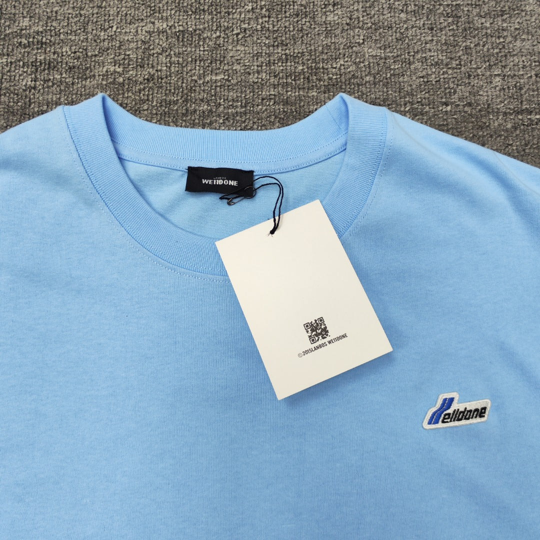 WE11D0NE Embroidered Logo Simple Color T-Shirt